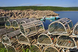 Canada, Nova Scotia, Neils Harbour. Boats and lobster traps in coastal village. Credit as Canada, Nova Scotia, Neils Harbour. Boats and lobster traps in coastal village. Credit as