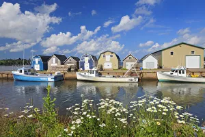 Canada, Prince Edward Island, New London. Fishing boats and sheds in coastal village Canada, Prince Edward Island, New London. Fishing boats and sheds in coastal village