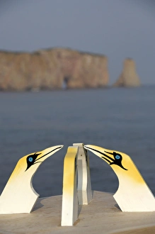 Canada, Quebec, Perce. Wooden gannets with view of St. Lawrence River & Perce Rock in distance Canada, Quebec, Perce. Wooden gannets with view of St. Lawrence River & Perce Rock in distance