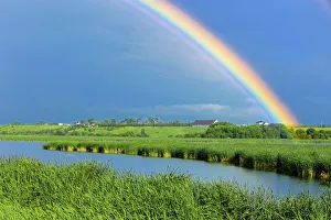 Canada, Quebec, St. Gedeon. Rainbow and barn after storm Canada, Quebec, St. Gedeon. Rainbow and barn after storm