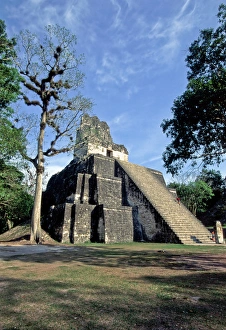 Central America, Guatemala, Tikal. The Temple of the Masks (Temple II) stands at Central America, Guatemala, Tikal. The Temple of the Masks (Temple II) stands at