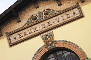 Ceramic sign saying Eaux de Vie at the old distillery. Town of Limoux. Limoux. Languedoc Ceramic sign saying Eaux de Vie at the old distillery. Town of Limoux. Limoux. Languedoc