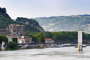 The Chateau de Tournon in the town Tournon and in the background a tower in ruins The Chateau de Tournon in the town Tournon and in the background a tower in ruins