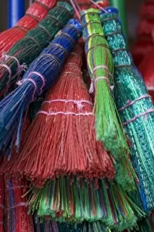 Images Dated 20th October 2004: Colorful Brooms for sale by street vendor, Alexandria Egypt