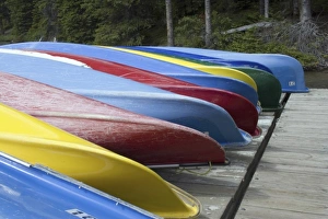 Colorful canoes at Moraine Lake, Banff National Park, Canada Colorful canoes at Moraine Lake, Banff National Park, Canada