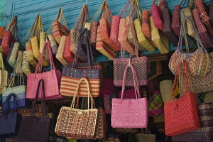 Colorful straw bags on display in market, Lima, Peru Colorful straw bags on display in market, Lima, Peru