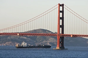 A container ship passes under the Golden Gate Bridge entering San Francisco Bay A container ship passes under the Golden Gate Bridge entering San Francisco Bay