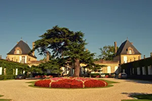 The court yard to Chateau Beychevelle in Saint Julien. Beautiful flower arrangements The court yard to Chateau Beychevelle in Saint Julien. Beautiful flower arrangements