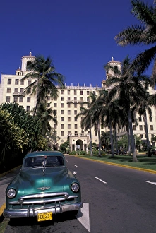 Cuba, Havana. Classic 1950s auto in front of Habana Nacional Hotel Cuba, Havana. Classic 1950s auto in front of Habana Nacional Hotel