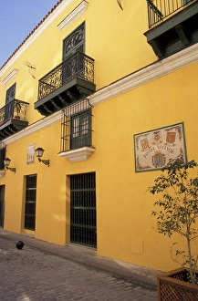 Cuba, Havana. Yellow Valencia Hostal wall and architecture Cuba, Havana. Yellow Valencia Hostal wall and architecture