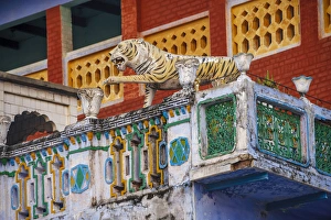 Decorated balcony with a tiger statue, Varanasi, India Decorated balcony with a tiger statue, Varanasi, India