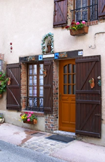 A decorated house with champagne symbols and flowers, the village of Hautvillers A decorated house with champagne symbols and flowers, the village of Hautvillers