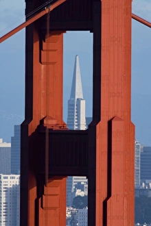 A dusk view of San Francisco with the Transamerica building through the Golden Gate Bridge A dusk view of San Francisco with the Transamerica building through the Golden Gate Bridge