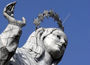 Ecuador, Quito. The Virgin of Panecillo watches over the capitol of Ecuador against a Ecuador, Quito. The Virgin of Panecillo watches over the capitol of Ecuador against a