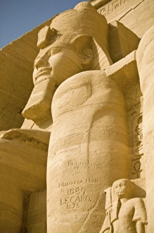 Egypt, Aswan. 19th century grafitti on Colossus of Ramses II at entrance of Abu Simbel Egypt, Aswan. 19th century grafitti on Colossus of Ramses II at entrance of Abu Simbel