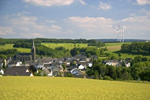 Electricity wind generators near a village in northwest Germany Electricity wind generators near a village in northwest Germany