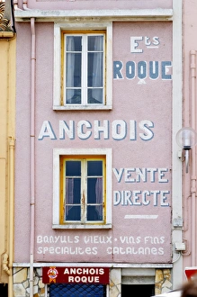 Etablissement Roque Anchois anchovies shop, house painted with advertising in white and pink Etablissement Roque Anchois anchovies shop, house painted with advertising in white and pink