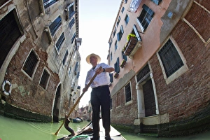 Euorpe; Italy; Venice; Wide Angle of Gondolier Traveling the Canals of Venice Euorpe; Italy; Venice; Wide Angle of Gondolier Traveling the Canals of Venice