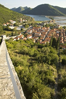 Europe, Croatia, Dalmatia, Mali Ston. Salt pans, lush hills and village of Mali Ston Europe, Croatia, Dalmatia, Mali Ston. Salt pans, lush hills and village of Mali Ston