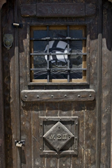 Europe, Greece, Santorini. Wooden pub door Europe, Greece, Santorini. Wooden pub door
