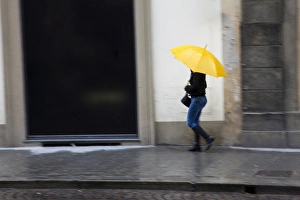 Europe; Italy; Florence; Woman walking in the rain on the streets of Florence Europe; Italy; Florence; Woman walking in the rain on the streets of Florence