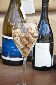 Europe; Italy; Monteriggoni; Chianti Wine and a Glass Full of Corks Europe; Italy; Monteriggoni; Chianti Wine and a Glass Full of Corks