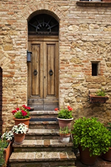 Europe; Italy; Tuscany; Pienza; Doorway withFlowers Around them Europe; Italy; Tuscany; Pienza; Doorway withFlowers Around them
