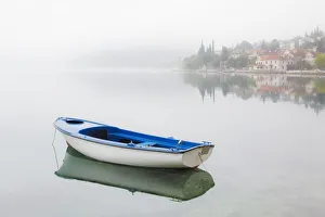 Europe, Montenegro, Kotar. Small boat on calm water Europe, Montenegro, Kotar. Small boat on calm water