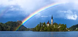 Europe, Slovenia. Rainbow over Lake Bled at sunset Europe, Slovenia. Rainbow over Lake Bled at sunset