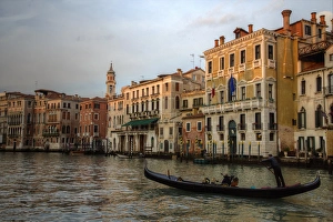 Evening light on Gondola along the Grand Canal near Rialto Bridge, Venice Italy Evening light on Gondola along the Grand Canal near Rialto Bridge, Venice Italy