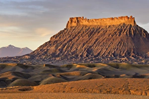 Factory Butte and The Henry Mountains in the Upper Blue Hills near Hanksville, Utah, USA Factory Butte and The Henry Mountains in the Upper Blue Hills near Hanksville, Utah, USA