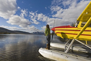 A fisherman on a floatplane in scenic Takahula Lake located along the National Wild A fisherman on a floatplane in scenic Takahula Lake located along the National Wild