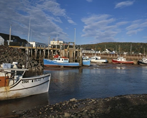 Fishing boats docked at low at in the Bay of Fundy town of Alma, New Brunswick, Canada Fishing boats docked at low at in the Bay of Fundy town of Alma, New Brunswick, Canada