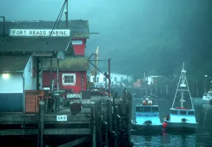 Two fishing boats tied up to pier at Noyo harbor, near Fort Bragg, California Two fishing boats tied up to pier at Noyo harbor, near Fort Bragg, California