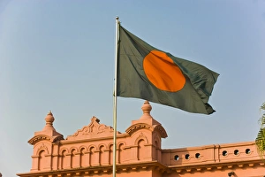 Flag of Bangladesh before the pink coloured Ahsan Manzil palace in Dhaka, Bangladesh Flag of Bangladesh before the pink coloured Ahsan Manzil palace in Dhaka, Bangladesh