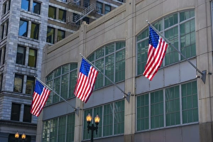 Flags hanging outside an office building in downtown, Chicago, Illinois, USA Flags hanging outside an office building in downtown, Chicago, Illinois, USA