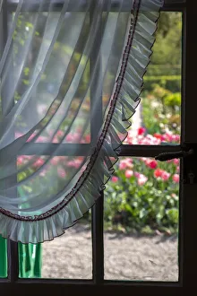 France, Giverny. Looking out at garden from kitchen in Monet's house France, Giverny. Looking out at garden from kitchen in Monet's house