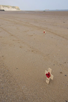 France, Normandy, Arromanches Beach. Remembrance crosses placed in the sand on the France, Normandy, Arromanches Beach. Remembrance crosses placed in the sand on the