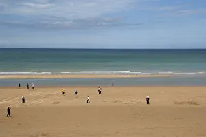 France, Normandy, Saint-Laurent-Sur-Mer, Omaha Beach. Tourists walking on historic France, Normandy, Saint-Laurent-Sur-Mer, Omaha Beach. Tourists walking on historic