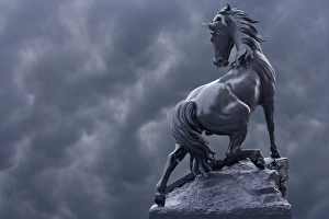 France, Paris. Horse sculpture against storm clouds at entrance of Musee d'Orsay France, Paris. Horse sculpture against storm clouds at entrance of Musee d'Orsay
