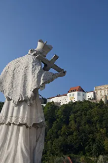 Germany, Passau. Bishop statue in front of hilltop Veste Oberhaus (aka Upper Fortress) Germany, Passau. Bishop statue in front of hilltop Veste Oberhaus (aka Upper Fortress)