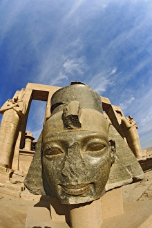 The giant head of Ramesses II, The Ramessuem on the West Bank at Luxor, Egypt The giant head of Ramesses II, The Ramessuem on the West Bank at Luxor, Egypt