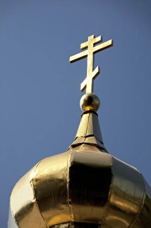 Golden cross of the Russian Orthodox Church on golden dome of Church of the Archangel Golden cross of the Russian Orthodox Church on golden dome of Church of the Archangel