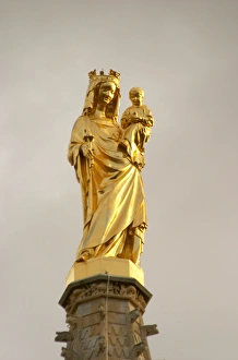 A golden madonna and child on the church tower of cathedral in bordeaux, newly renovated A golden madonna and child on the church tower of cathedral in bordeaux, newly renovated