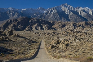 Gravel Road leading towards the Eastern Sierra Mountains in the Alabama Hills of Gravel Road leading towards the Eastern Sierra Mountains in the Alabama Hills of