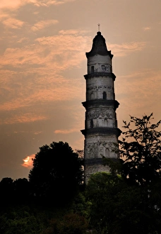 Great Mercy Pagoda, Shaoxing, Zhejiang Province, China, Sunrise in orange pink sky Great Mercy Pagoda, Shaoxing, Zhejiang Province, China, Sunrise in orange pink sky