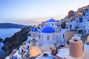 Greece, Santorini, Oia. Sunset on coastal town Greece, Santorini, Oia. Sunset on coastal town