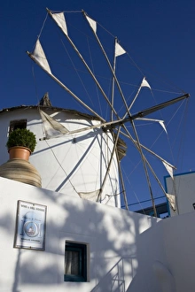 Greece, Santorini. White windmill against blue sky Greece, Santorini. White windmill against blue sky