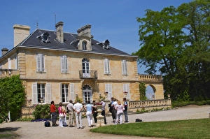 A group of visiting wine tasters in the garden in front of the chateau Chateau Kirwan A group of visiting wine tasters in the garden in front of the chateau Chateau Kirwan