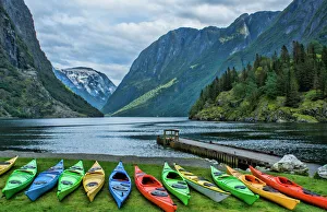 Gudvangen Norway fabulous fjord called Naeroyforden Fjord with colorful kayaks in water Gudvangen Norway fabulous fjord called Naeroyforden Fjord with colorful kayaks in water
